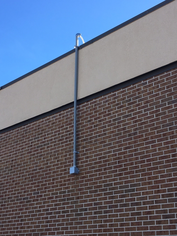 JDTECK ensures its techs encases in conduit any exterior cables that route up the side of a building. Besides presenting a very neat appearance, the life of the cable is also greatly extended. 
