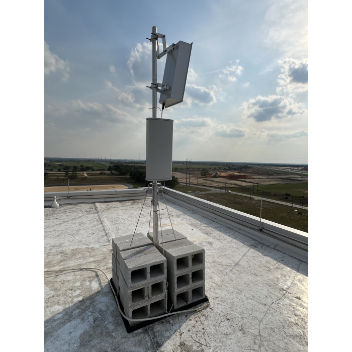 5G Small Cell in the parking lot of a hospital provides ample high-speed data capacity to in-building DAS. 